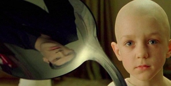 The child from the Matrix says, "There is no spoon." Neo's reflection can be seen inverted in the spoon.